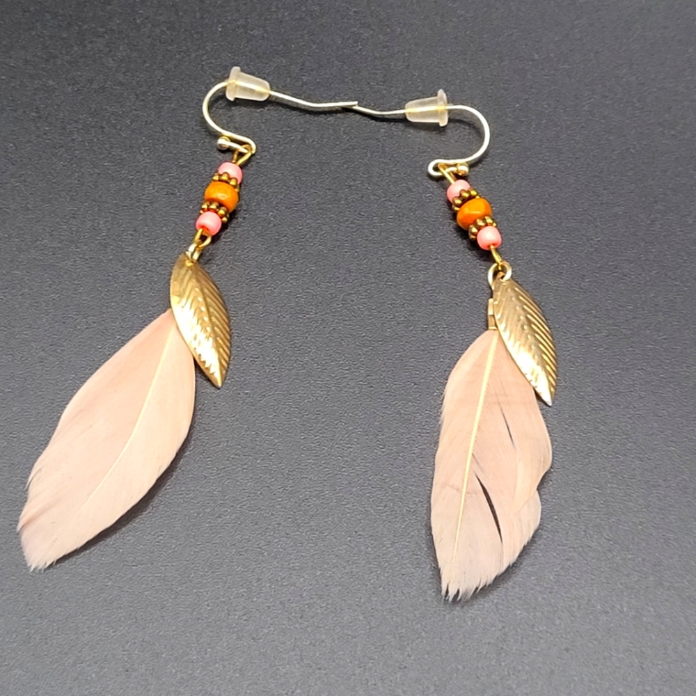 Hand beaded feathers earrings made by Bougie Birch